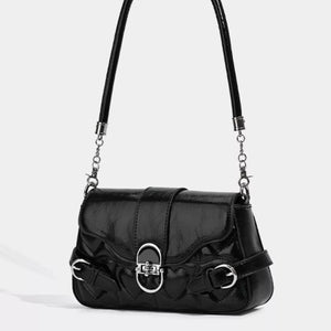 Black heart-quilted crossbody bag with buckle accent and chain detail