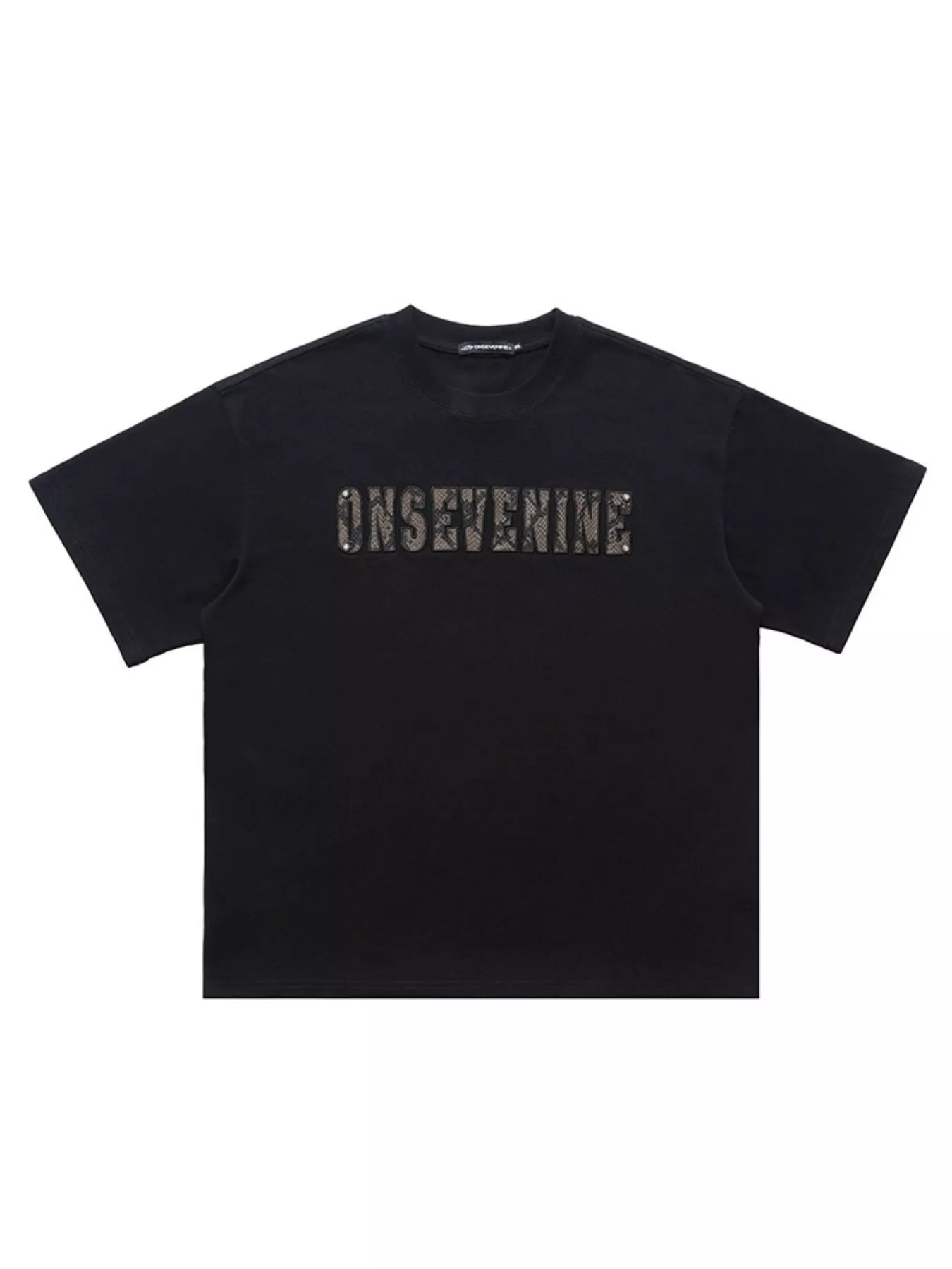 Black oversized cotton t-shirt with textured logo detail on chest