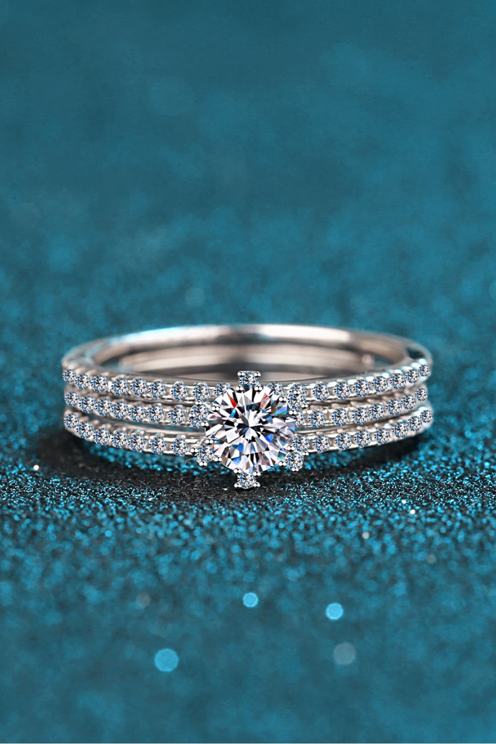 Silver ring trio with a central diamond and pavé band details