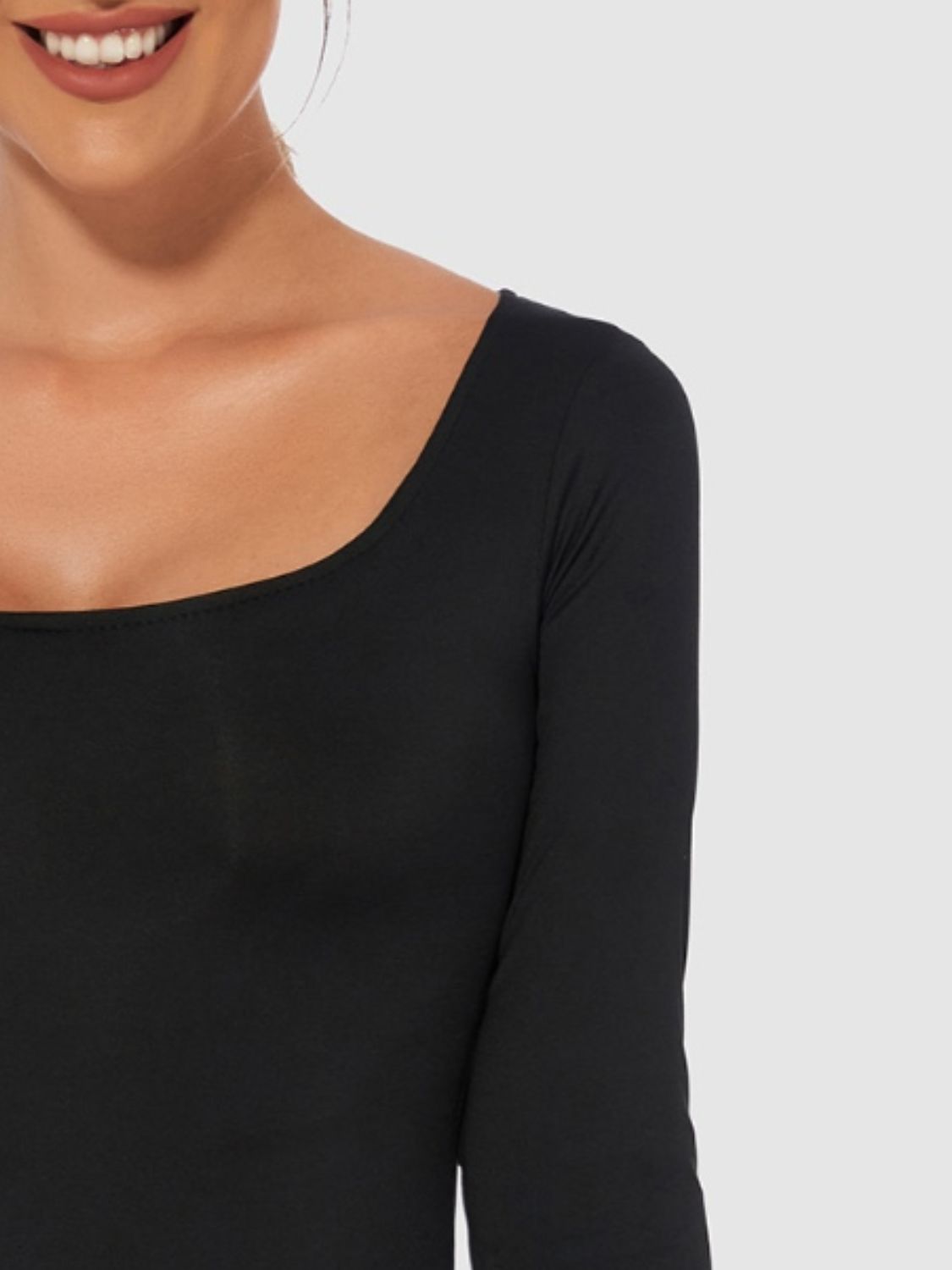 Black second-skin bodysuit with long sleeves and a square neckline.