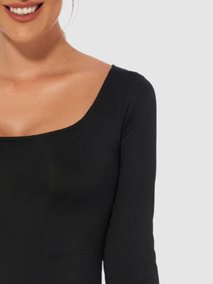 Black second-skin bodysuit with long sleeves and a square neckline.