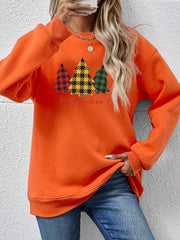 Orange crewneck sweatshirt with plaid Christmas trees graphic and Merry Christmas text.