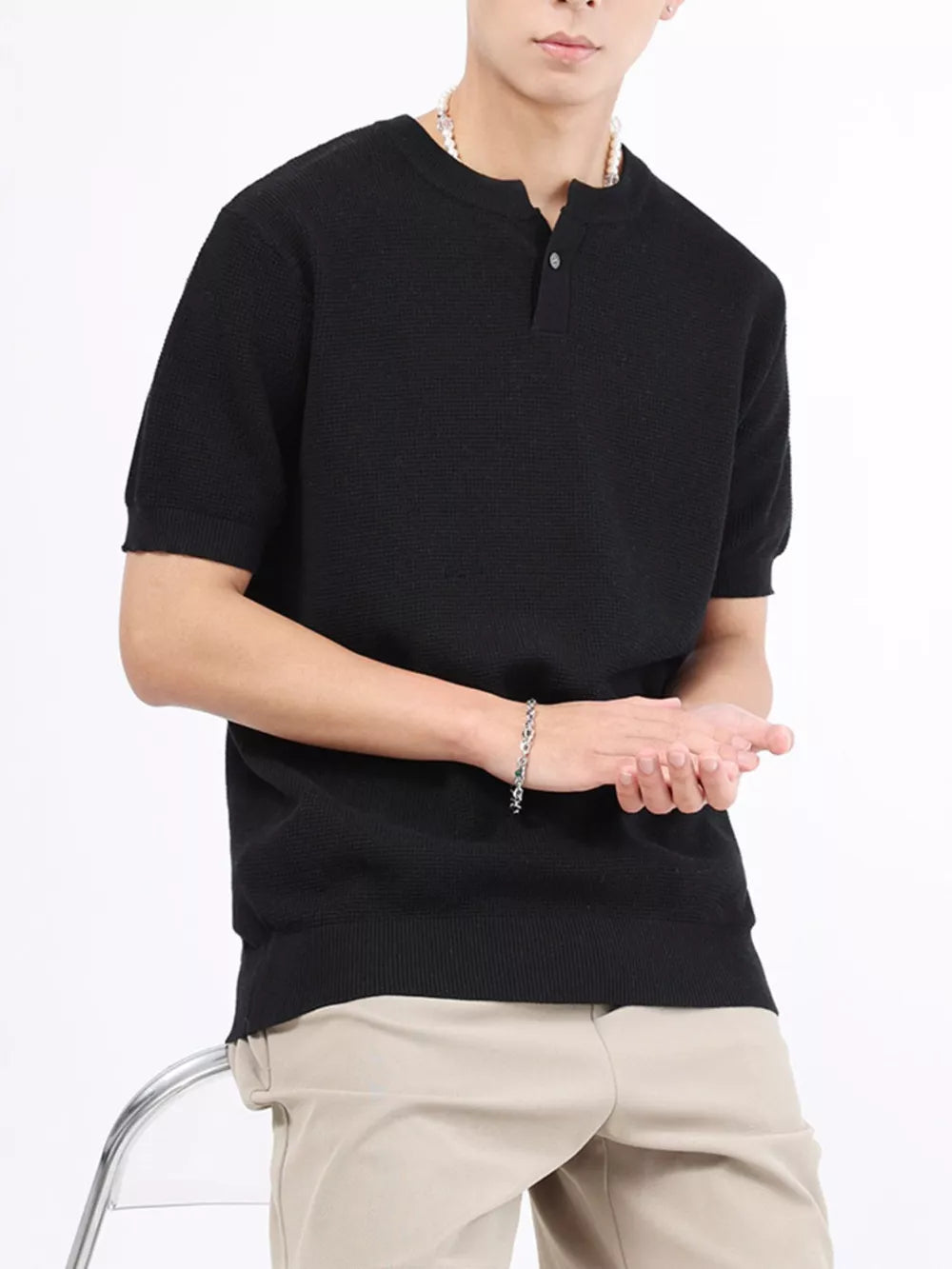 Black knit henley t-shirt for men with short sleeves and a two-button placket.