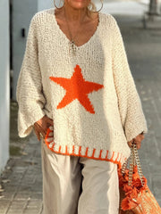 Cream knit v-neck pullover with orange star detail and ribbed hem.