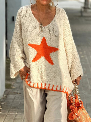 Cream knit v-neck pullover with orange star detail and ribbed hem.