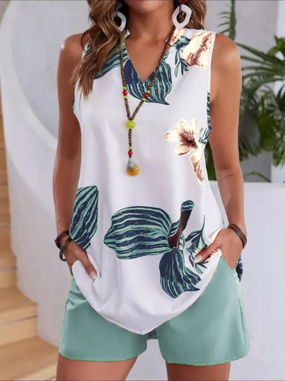 Floral V-neck sleeveless top with teal pocketed shorts set