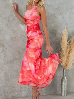 One-shoulder maxi dress in red floral print with ruched detailing and asymmetrical neckline.