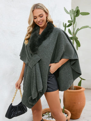 Dark green faux fur collar wrap poncho with tie detail and pom-pom accents.