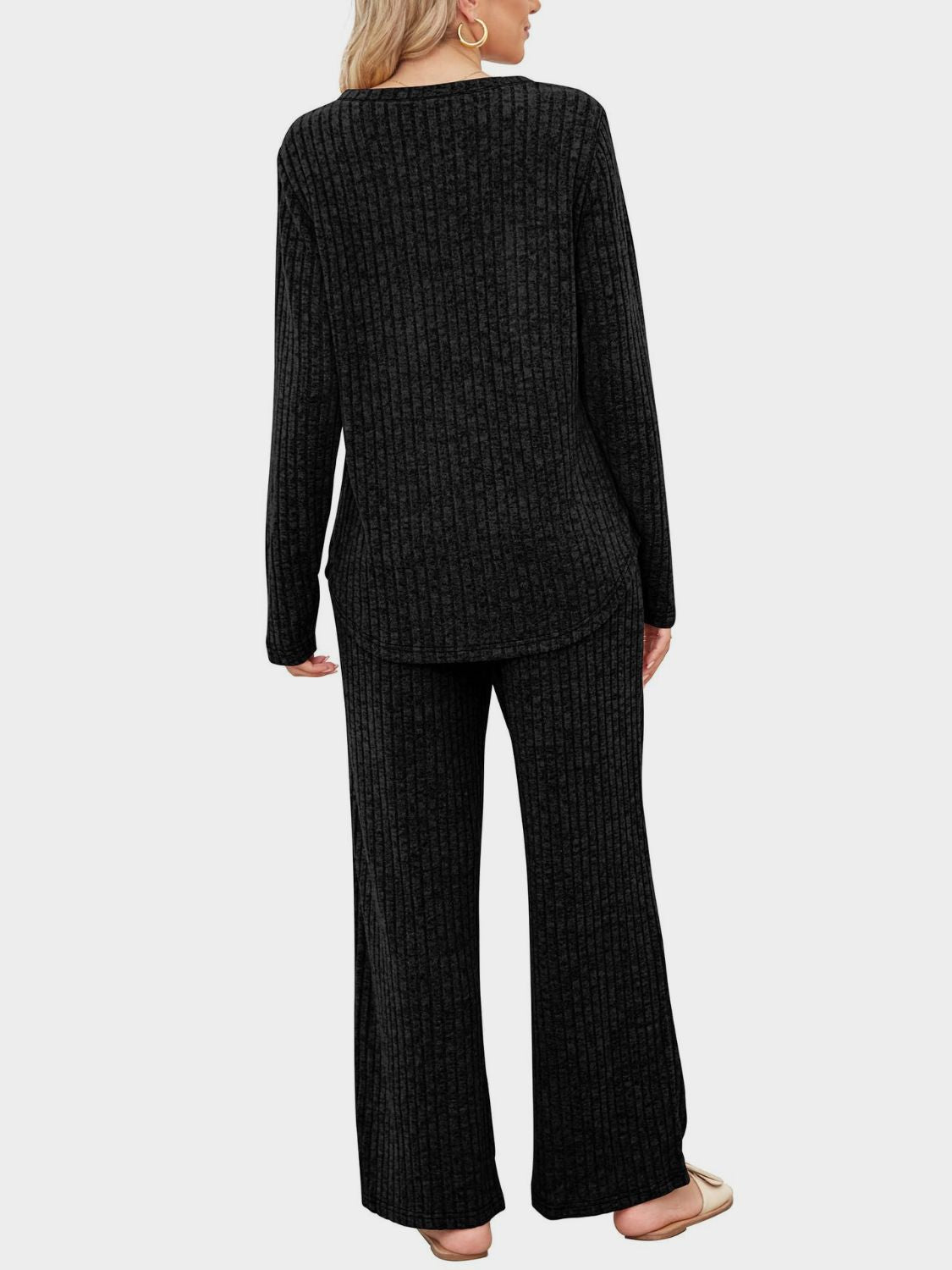 Black ribbed knit lounge set with long sleeve top and wide leg pants.