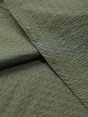 Army green cotton casual shirt with textured pattern and visible stitching.