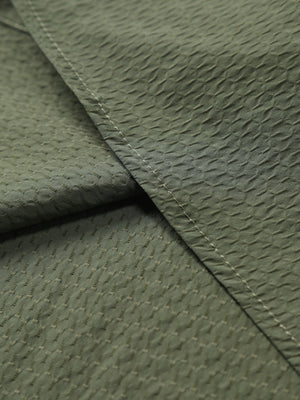 Army green cotton casual shirt with textured pattern and visible stitching.
