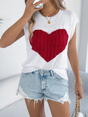 White cable knit sweater vest with a red cable knit heart graphic.