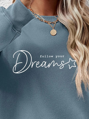 Dreams Scripted Oversized Sweatshirt in Misty Blue with graphic text and star detail.