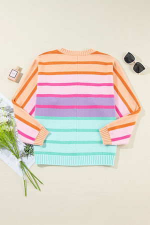 Ombre stripe knit sweater with ribbed cuffs in sherbet and turquoise colors.