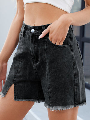 Black denim shorts with split front, frayed hem and raw edges.