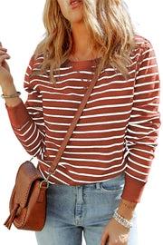 Nautical stripe crewneck sweatshirt in red orange with white stripes, long sleeves, and crew neckline.