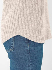 Relaxed fit ribbed V-neck t-shirt in light beige, showing hem detail.