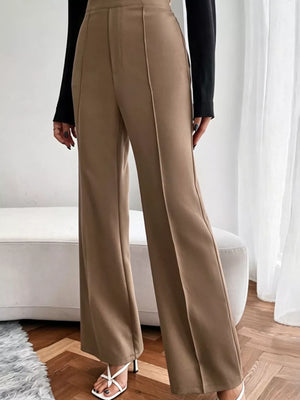Brown high-waisted flare maternity pants with front seams and a wide leg.
