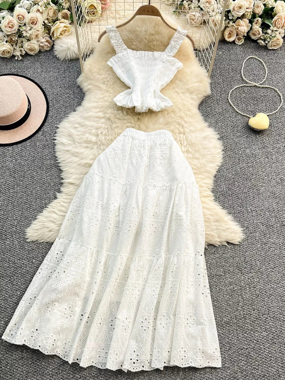 White ruffled crop top and eyelet maxi skirt set with tiered skirt detail.
