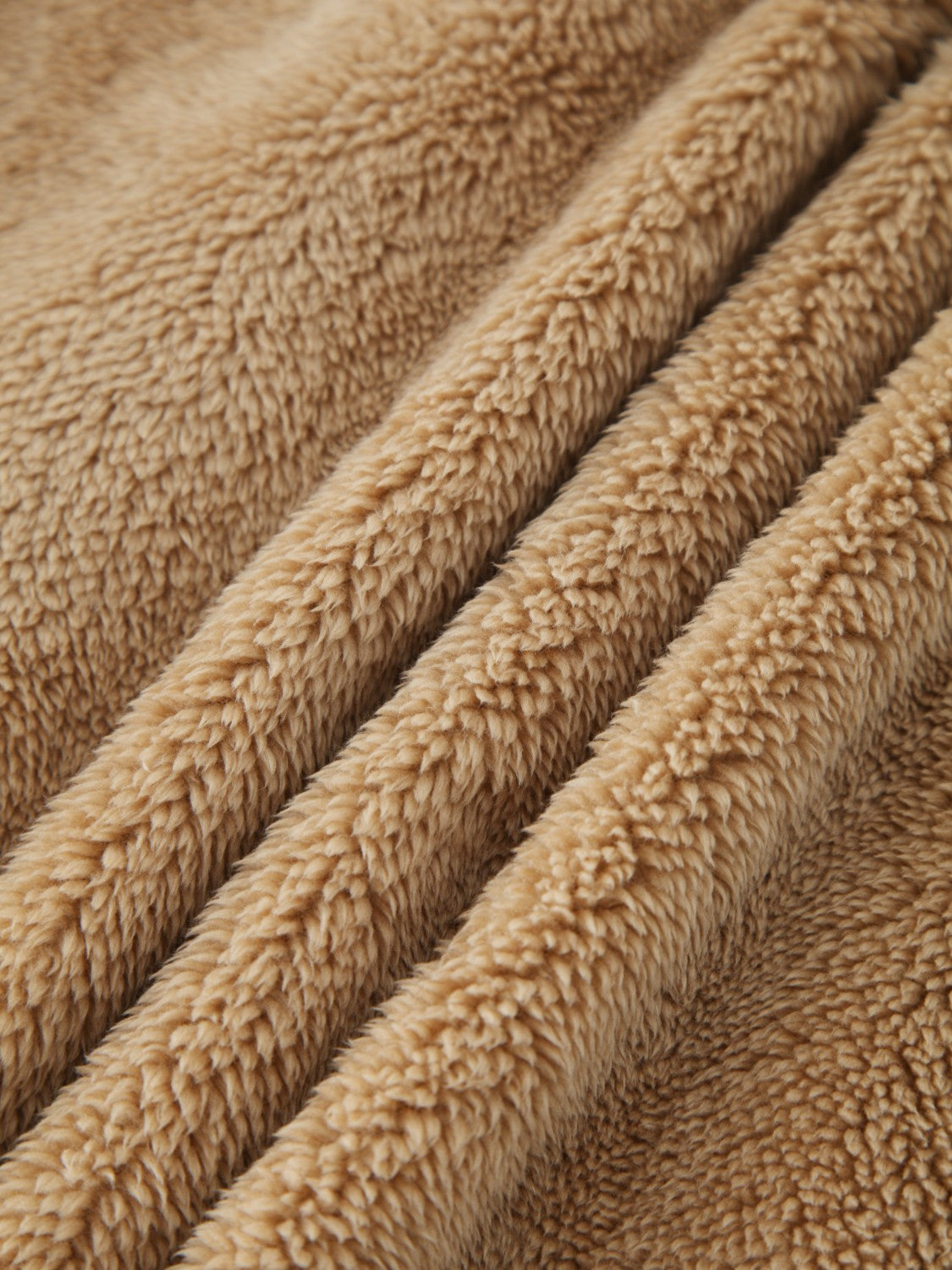 Khaki teddy shacket fabric detail, plush and soft texture.