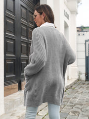 Light gray ribbed knit cocoon cardigan with pockets and a relaxed fit.