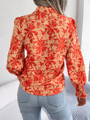 Floral print blouse in pumpkin with shirred cuffs and puff sleeves