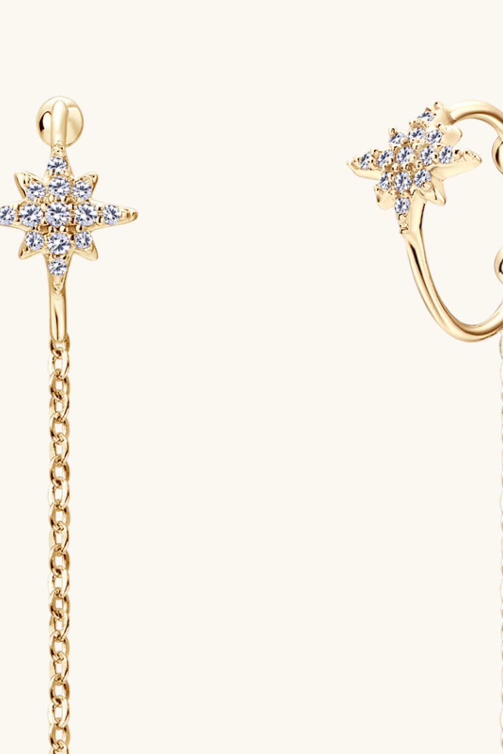 Gold moissanite starburst threader earrings with delicate chain detail.