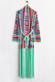 Granny square crochet duster with fringe in multicolor and mint green, belted, long sleeves.