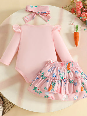 Pink baby girl outfit with bunny and floral print skirt, ruffled sleeves, and matching headband.