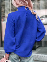 Royal blue textured puff sleeve blouse with smocked neck and buttoned back detail.