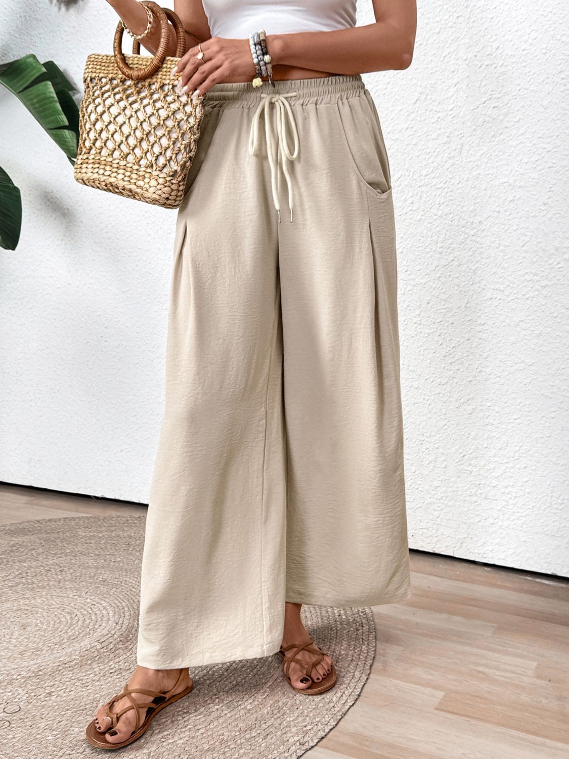 Tan Luxe Drape Palazzo Trousers with drawstring waist and pockets.