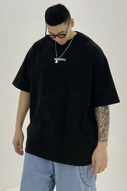 Black oversized t-shirt with white logo detail and crew neck