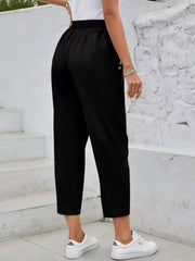 Black textured elastic waist cropped trousers with button detail
