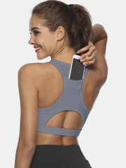 Gray racerback sports bra with phone pocket and cutout detail