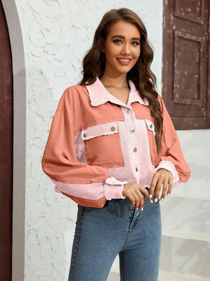 Textured colorblock cropped jacket in pink and coral with raw edges and button pockets.