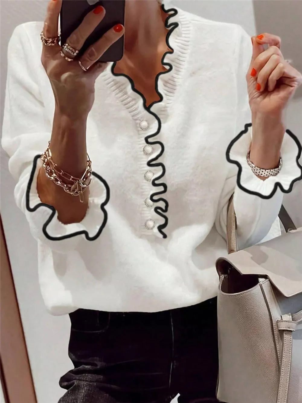 Chic white knit sweater with ruffled V-neck and cuffs, pearl buttons, acrylic.