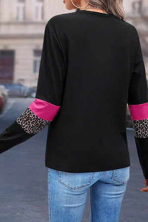 Black long sleeve tee with fuchsia pink and leopard print panel details on sleeves.