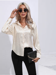 Champagne satin leopard print button-down shirt with a collared neckline and long sleeves.