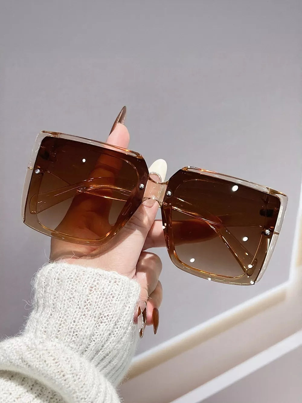 Oversized square gradient sunglasses in coffee brown with clear frames and silver stud details.