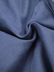 Blue faded cargo capris with distressed detailing and subtle texture.