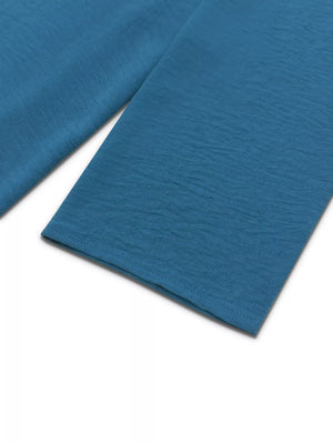 French blue textured maxi dress with button-down detail and drawstring waist.