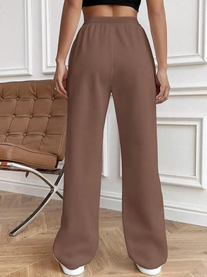 Brown wide-leg lounge trousers with a relaxed fit and elastic waistband.