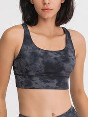 Crisscross Back Performance Bra in dark gray tie-dye with scoop neck and wide band.