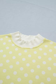 Pastel yellow polka dot top with ruffled neckline detail
