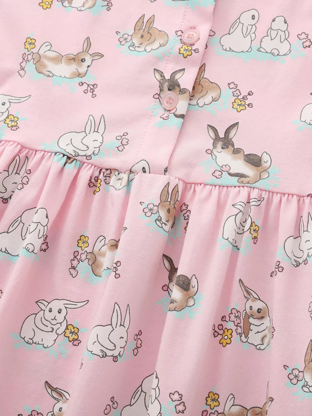 Pink cotton toddler dress with a cute bunny print and ruffled hem.