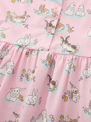 Pink cotton toddler dress with a cute bunny print and ruffled hem.