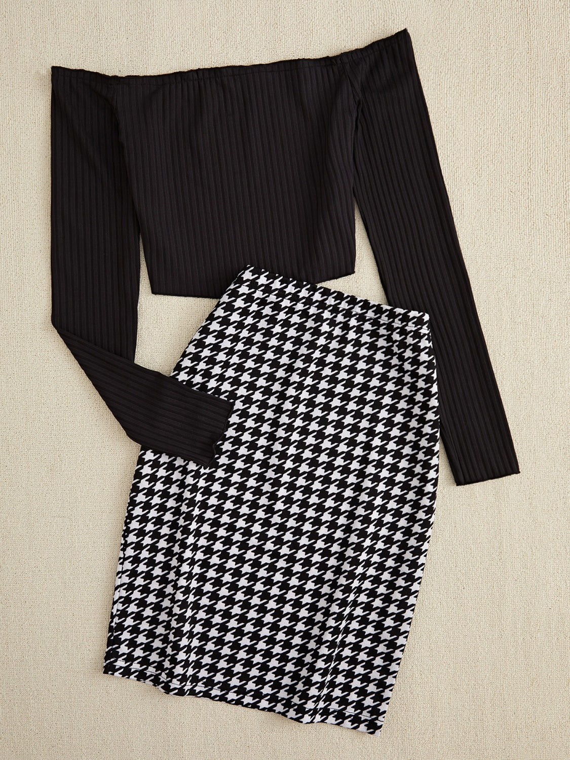 Black houndstooth pencil skirt and ribbed off-shoulder long sleeve top.