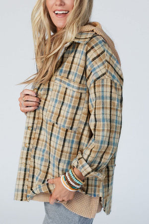 Textured plaid hooded overshirt with raw hem and button-up front.