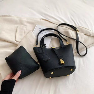 Bucket Crossbody Bag With Lock Detail in White, front view