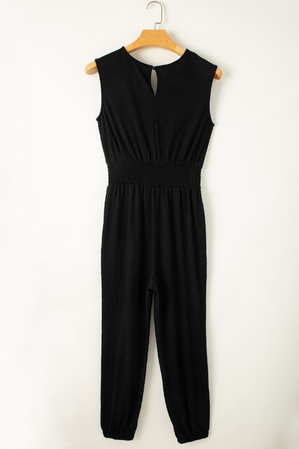 Black textured ribbed waist jumpsuit with keyhole neckline and cuffed legs
